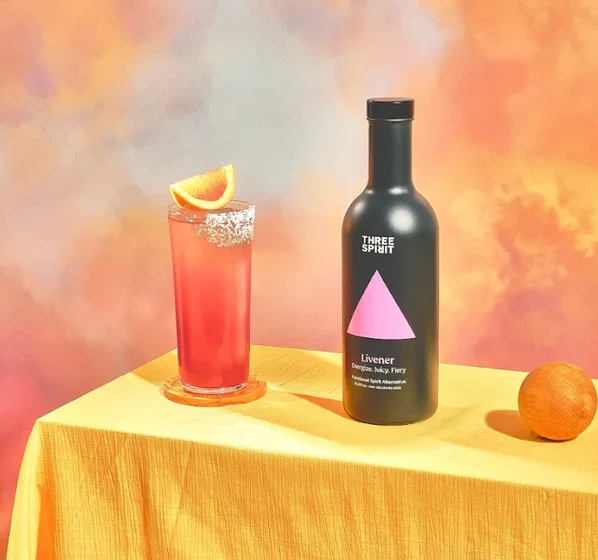 Three Spirit Livener Mocktail and bottle